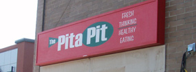 Flourescent cabinet signage for The Pita Pit