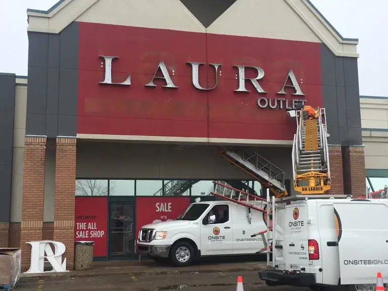 Signage installation at Laura